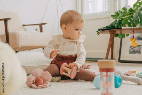 Baby on floor with toys 