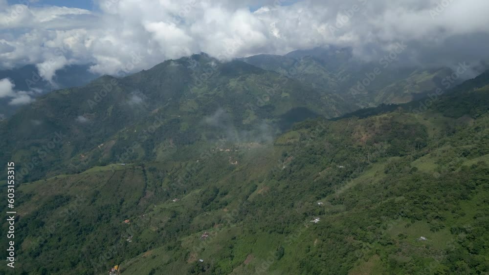 Flights over mountains covered in forests with clouds above close to the city of Arboledas, Colombia. Flights over mountains covered in forests with clouds above close to the city of Arboledas, Colombia.