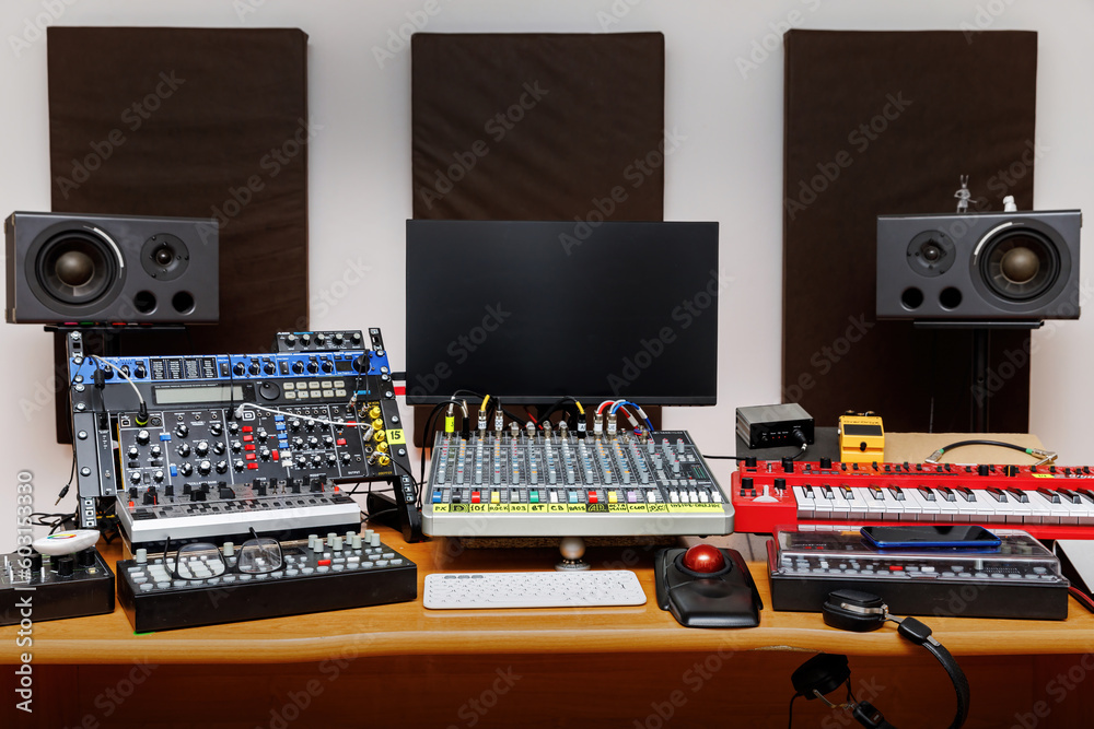Sound engineer equipment set-up at a music production studio. - obrazy, fototapety, plakaty 