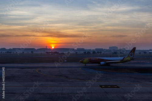 BANGKOK, THAILAND - DECEMBER 16, 2019: Sunrise at Dong Mueang airport in Bangkok, Thailand photo