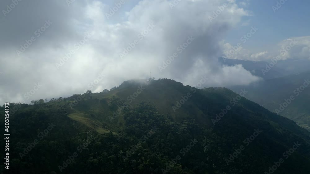 Flight through clouds over a forest covered mountain in Arboledas, Colombia Flight through clouds over a forest covered mountain in Arboledas, Colombia