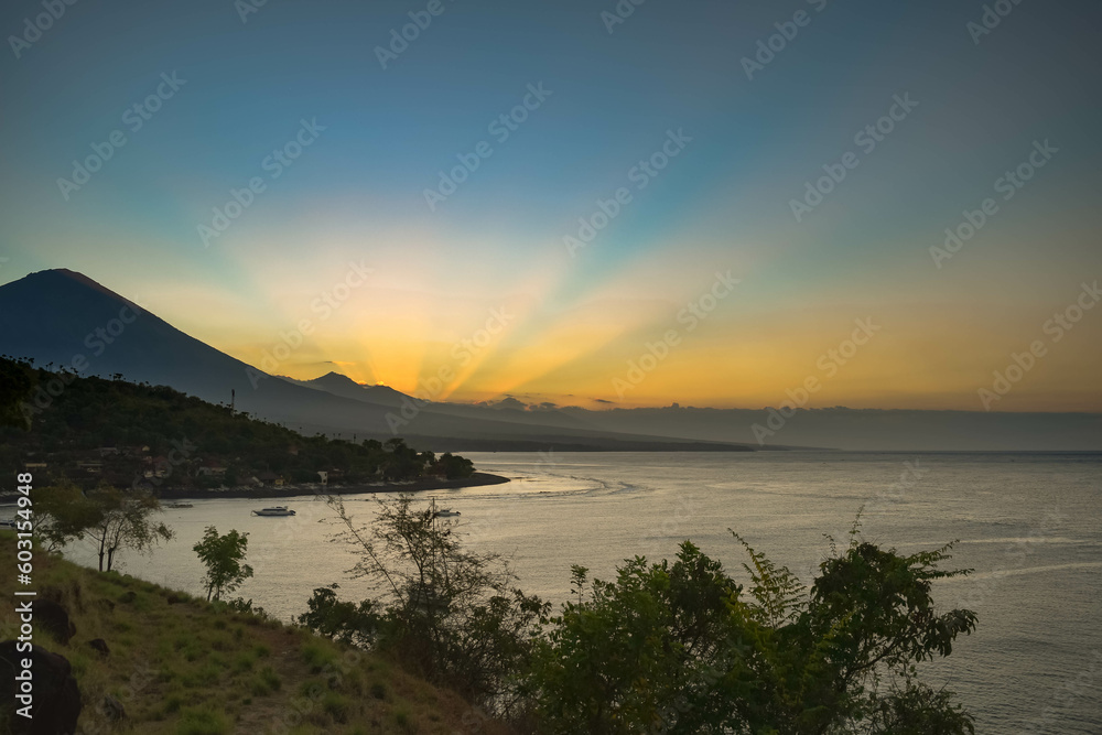 sunset at amed beach, view agung mount. bali