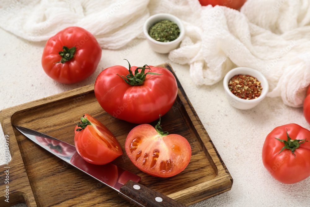 Wooden board with fresh tomatoes on white background Wooden board with fresh tomatoes on white background