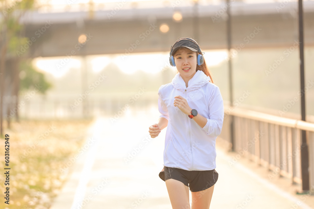 Young woman running on city road sunset,woman fitness silhouette sunrise jogging workout wellness concept. Young woman running on city road sunset,woman fitness silhouette sunrise jogging workout wellness concept.