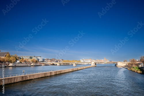 Panorama of Maastricht Waterfront on the Meuse Maas river with a focus on sint wilhelminabrug or Wilhelmina Bridge, in autumn, during a sunny afternoon. Maastricht is a dutch city in the netherlands i © Jerome