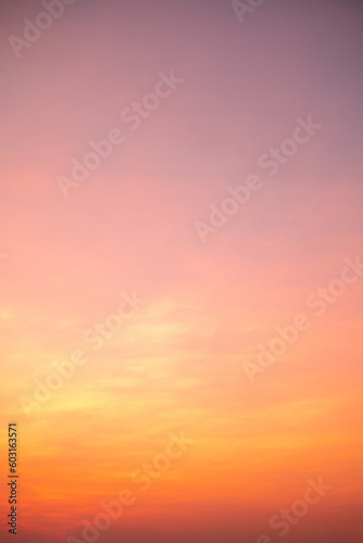 beautiful , luxury soft gradient orange gold clouds and sunlight on the blue sky perfect for the background, take in everning,Twilight, vertical image