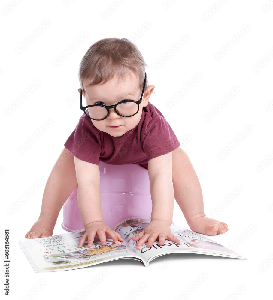 Little child with glasses and book sitting on baby potty against white background Little child with glasses and book sitting on baby potty against white background