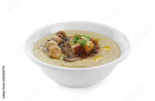 Delicious cream soup with mushrooms and croutons on white background
