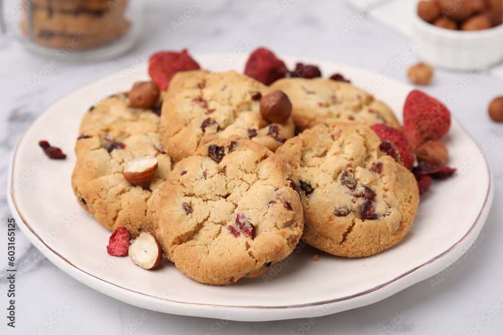 Cookies with freeze dried fruits and nuts on white marble table, closeup Cookies with freeze dried fruits and nuts on white marble table, closeup