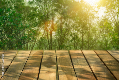 Empty wooden surface against bright sunshine forest background , display podium for product mockups 3d trade show display advertising, Natural blurred defocused background