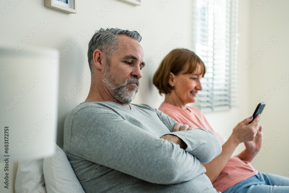 Phone addiction, Caucasian wife doesn't pay attention to her husband. Phone addiction, Caucasian wife doesn't pay attention to her husband.