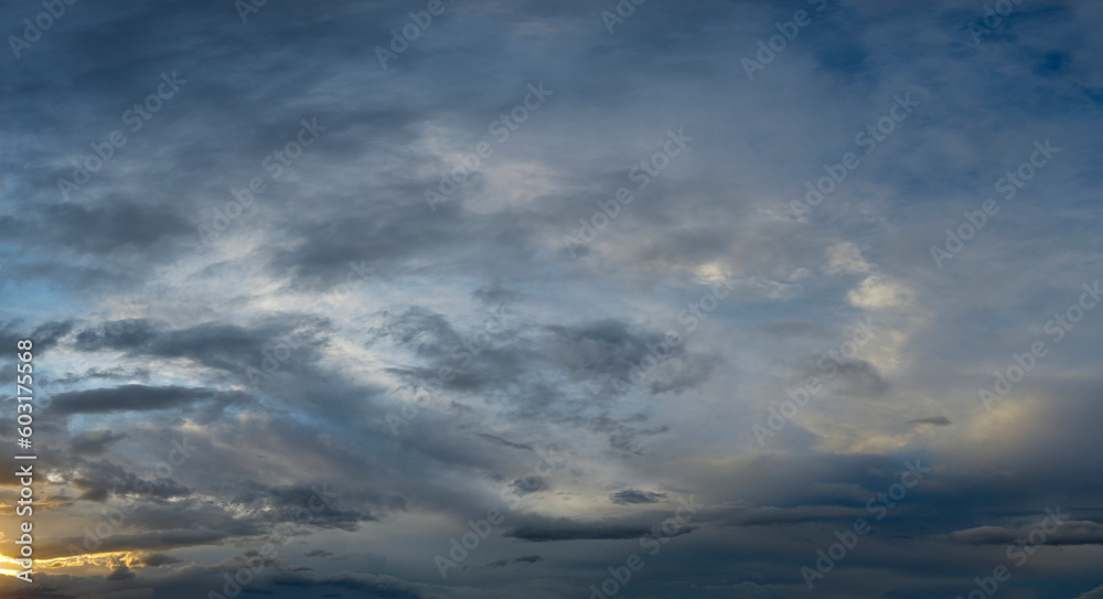 Russia. South of Western Siberia. Gloomy sunset clouds in the evening summer sky over the mountain ranges of Altai. Russia. South of Western Siberia. Gloomy sunset clouds in the evening summer sky over the mountain ranges of Altai.