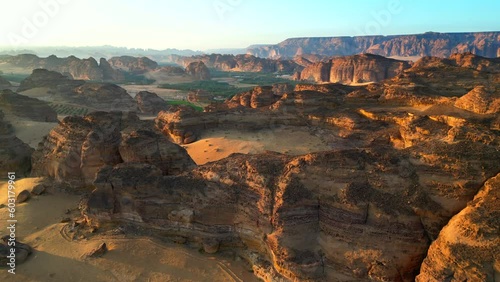 Drone shot beautiful desert landscape in Saudi Arabia at sunset photo