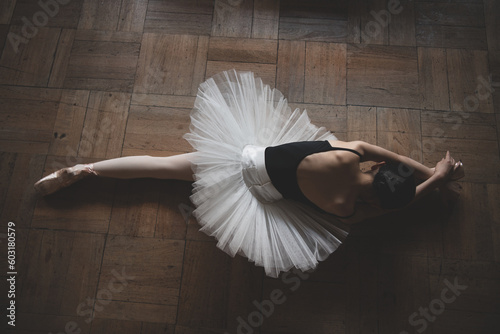 ballerina stretching on the floor 