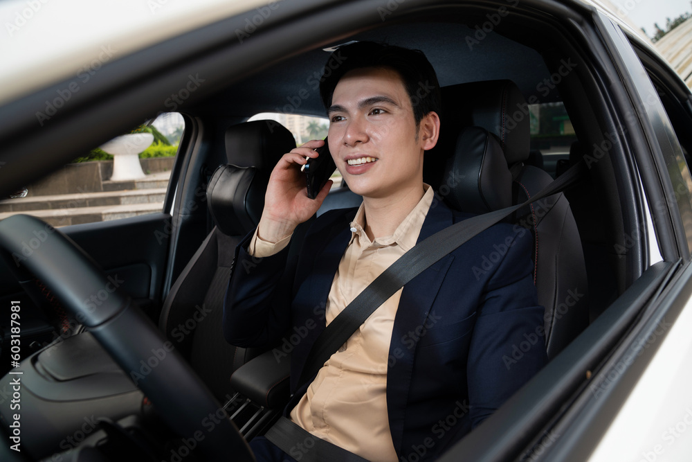 Young Asian business man with car