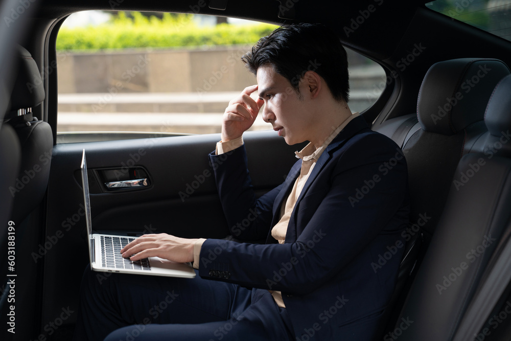 Young Asian business man with car