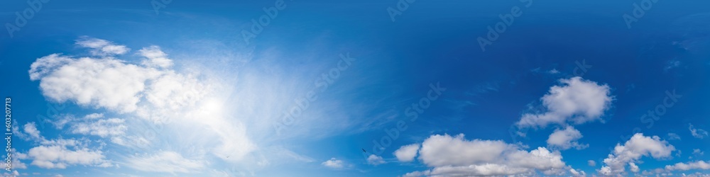Blue summer 360 panorama of sky with clouds, no ground, in spherical equirectangular format for easy use in 3D graphics and aerial or ground composites, seamless and suitable for sky replacement. Blue summer 360 panorama of sky with clouds, no ground, in spherical equirectangular format for easy use in 3D graphics and aerial or ground composites, seamless and suitable for sky replacement.