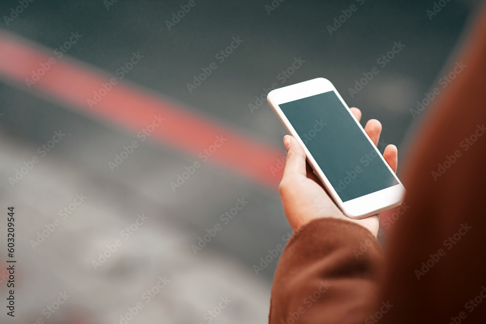 Woman, hands and phone in city with mockup screen for travel, location or road side service. Hand of female person or traveler holding mobile smartphone app with display for copy space in urban town