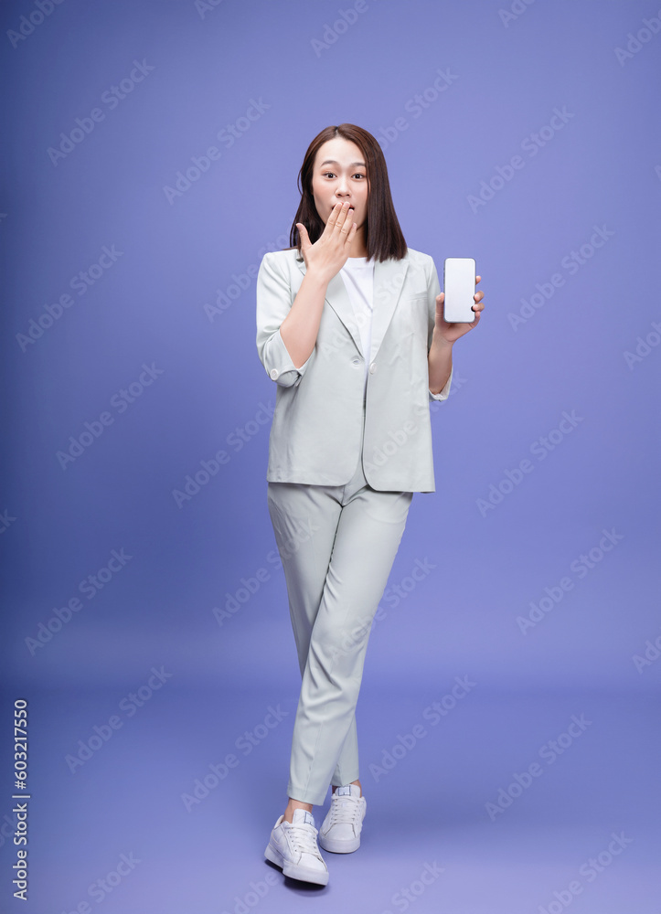 Full length photo of young Asian businesswoman on background Full length photo of young Asian businesswoman on background
