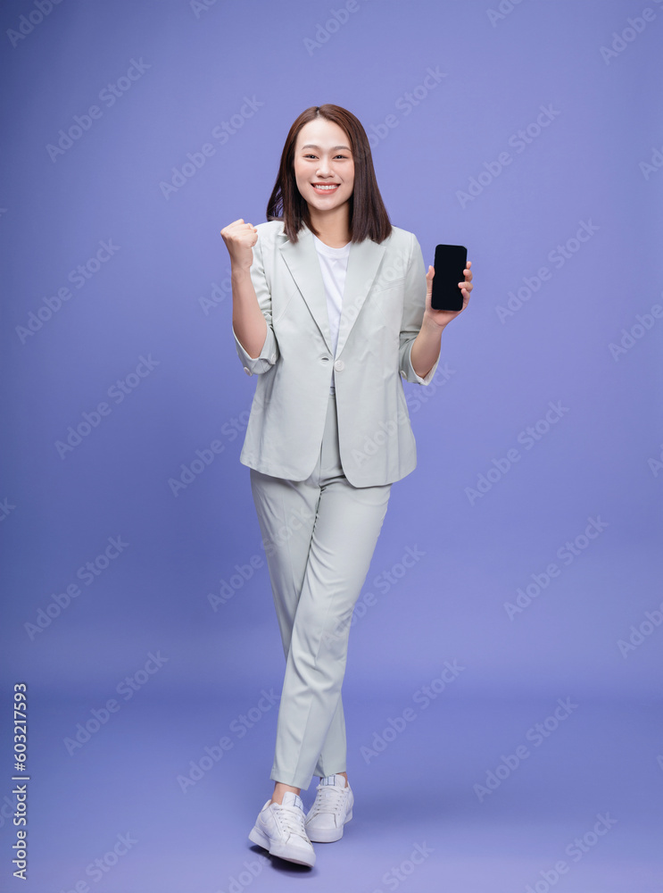 Full length photo of young Asian businesswoman on background Full length photo of young Asian businesswoman on background