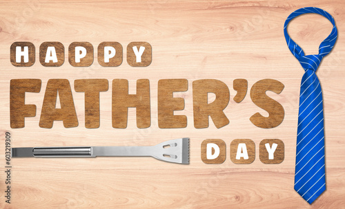Happy Father's Day Wooden lettering on wooden background