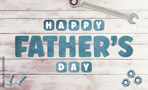 Happy Father's Day Wooden lettering on wooden background