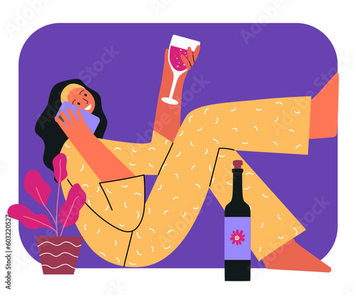 Joyful smiling girl in pajamas talking on the phone and drinking wine. Relaxation, weekend at home concept.