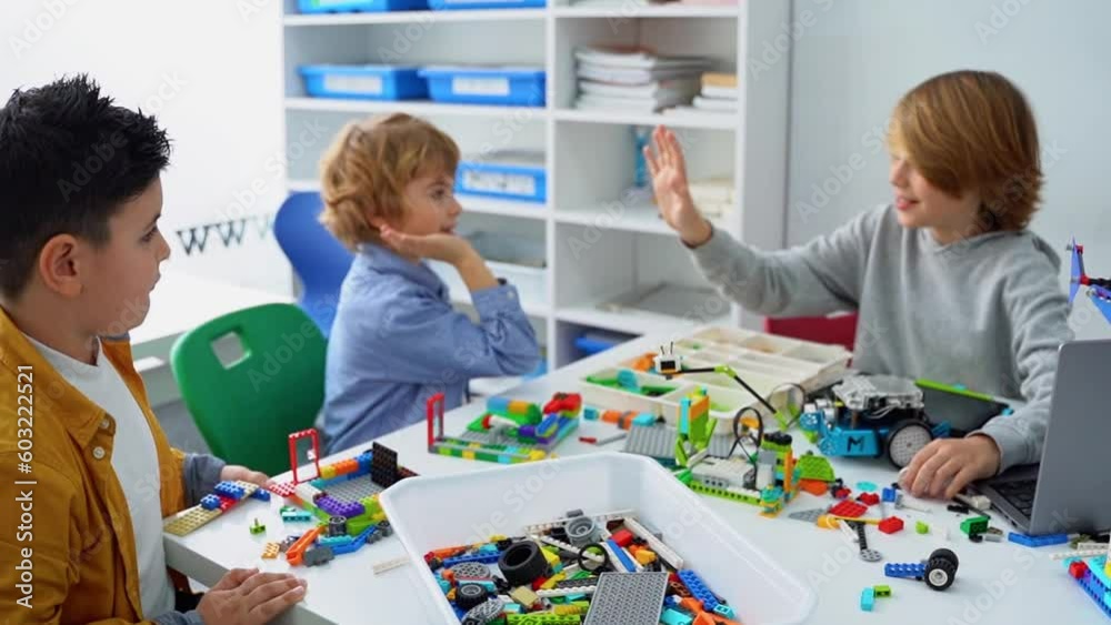 Robotics programming class. Children construct and code Robot. STEM ...