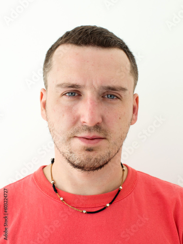 Passport Photo. Portrait Of Middle Aged Man Looking At Camera Over White Studio Background. Isolated