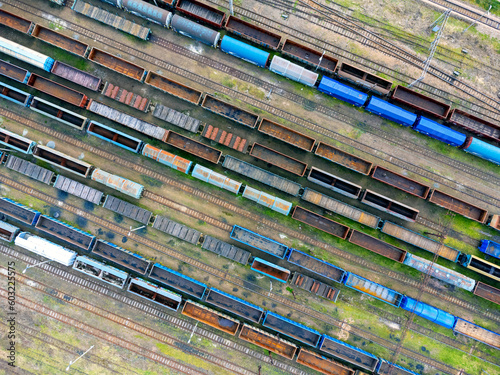Obraz na płótnie Aerial view landscape. View of trains, railroad tracks, cars, cargo. Photo from a drone. Coal transportation. w salonie