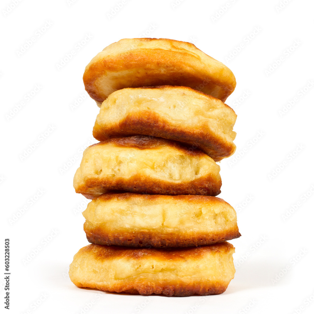 A stack of pancakes on a white background. Homemade pancakes. Close-up baking. A stack of pancakes on a white background. Homemade pancakes. Close-up baking.