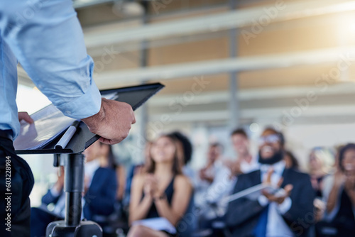 Closeup, presentation and speaker with crowd, applause or speech with workshop, seminar or discussion. Zoom, male person or leader with audience, announcement or motivation with support or solidarity