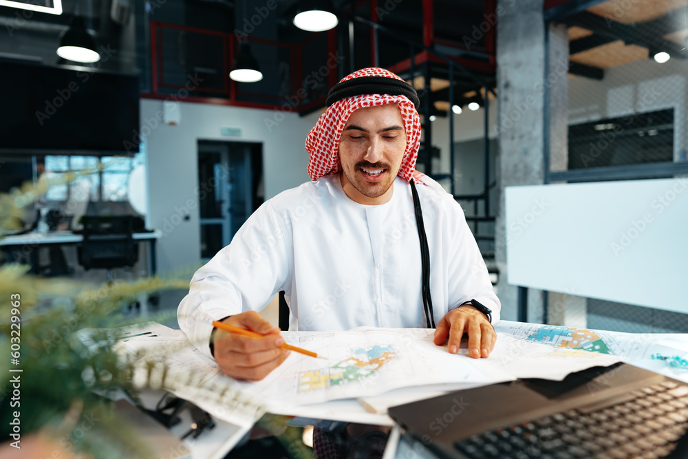 Young successful arab businessman working in the office