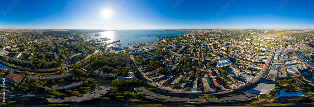 Kerch, Crimea - August 31, 2020: Panorama of the city, port and Crimean bridge aerial view. Panorama 360