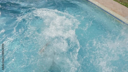 Two boys jumping swimming pool jump water kids swimming boy water fun summer children playing water summer. Cheerful children swiming fun pool children jump kids splashing in pool kids summer holiday.