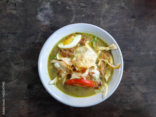 Indonesian chicken soto or soto ayam, served with white rice photo