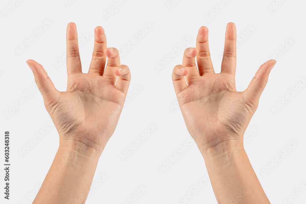 Hand of woman showing thumb-up gesture on white background Hand of woman showing thumb-up gesture on white background