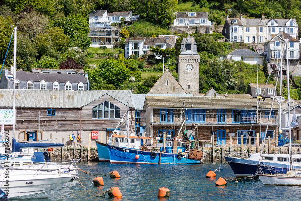 Fishing boats in the bay at Looe Harbour  and beach in Cornwall