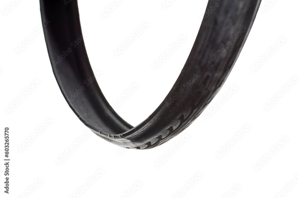 Closeup of One New Road Bike Folded Tyre Placed Unfolded Free Over White Closeup of One New Road Bike Folded Tyre Placed Unfolded Free Over White