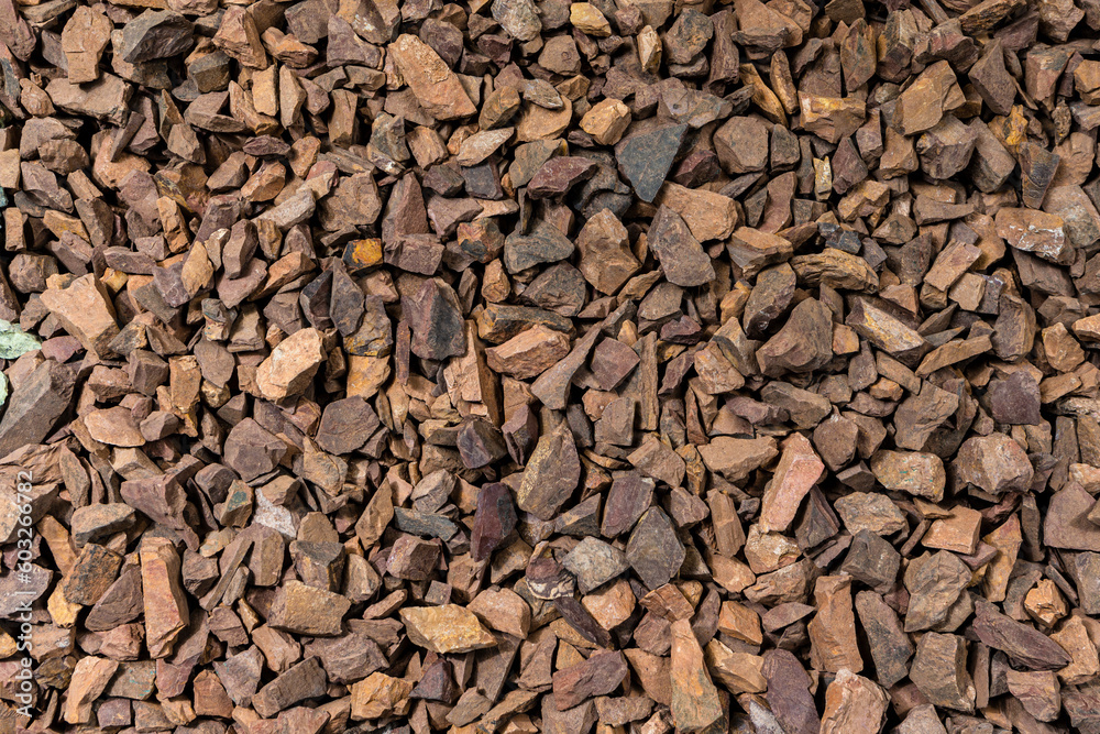Close-up Image of Background Made of Pile of Colorful Brown, Yellow and Red Crushed Stones. Close-up Image of Background Made of Pile of Colorful Brown, Yellow and Red Crushed Stones.
