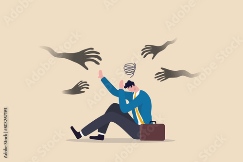 Fear or afraid of failure, struggle or shackle, feeling depressed or disorder, phobia, anxiety or stressed burnout or negative thinking concept, fearful businessman sitting with evil hand threaten. photo