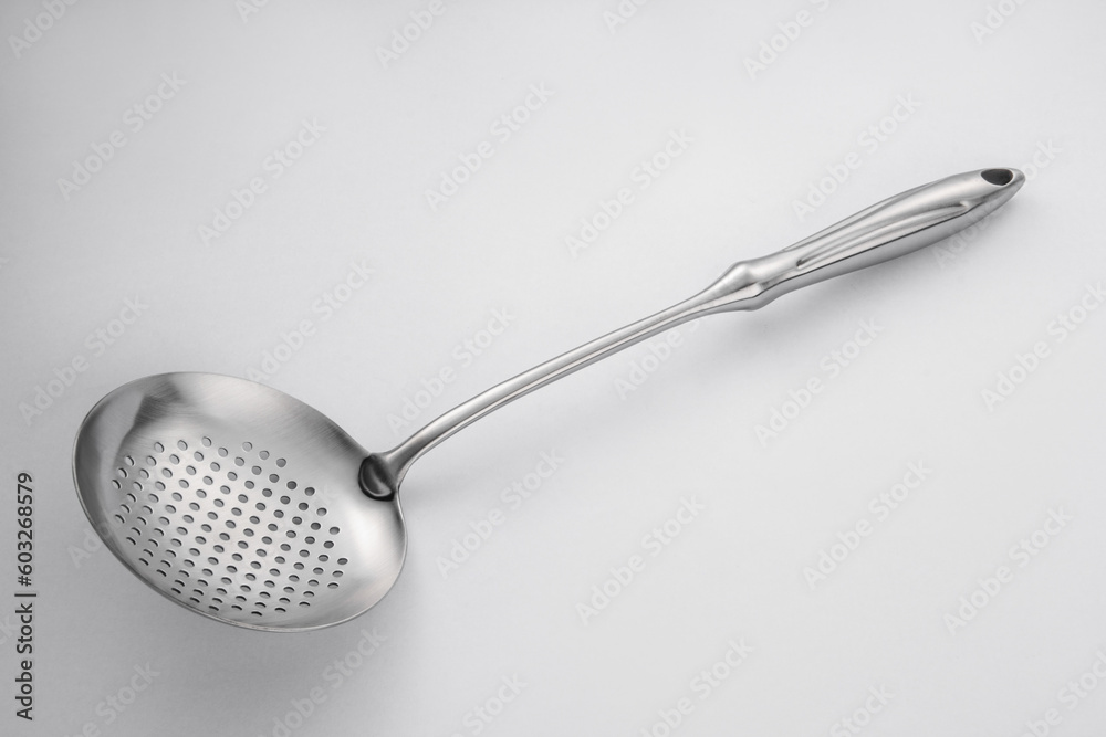 Stainless steel tableware and kitchen utensils placed on the desktop Stainless steel tableware and kitchen utensils placed on the desktop