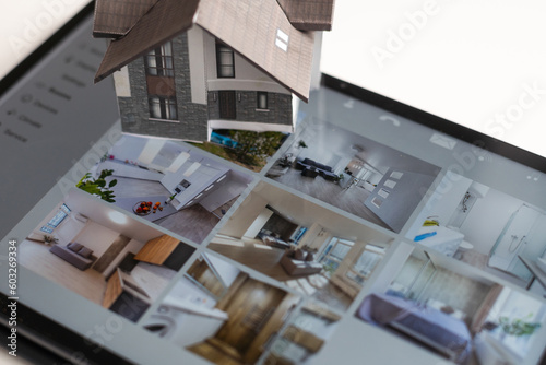 Fototapeta Naklejka Na Ścianę i Meble -  Small house model is on screen tablet and icons home electronics devices connecting with wireless. Smart home controlled and Automation system technology of things.