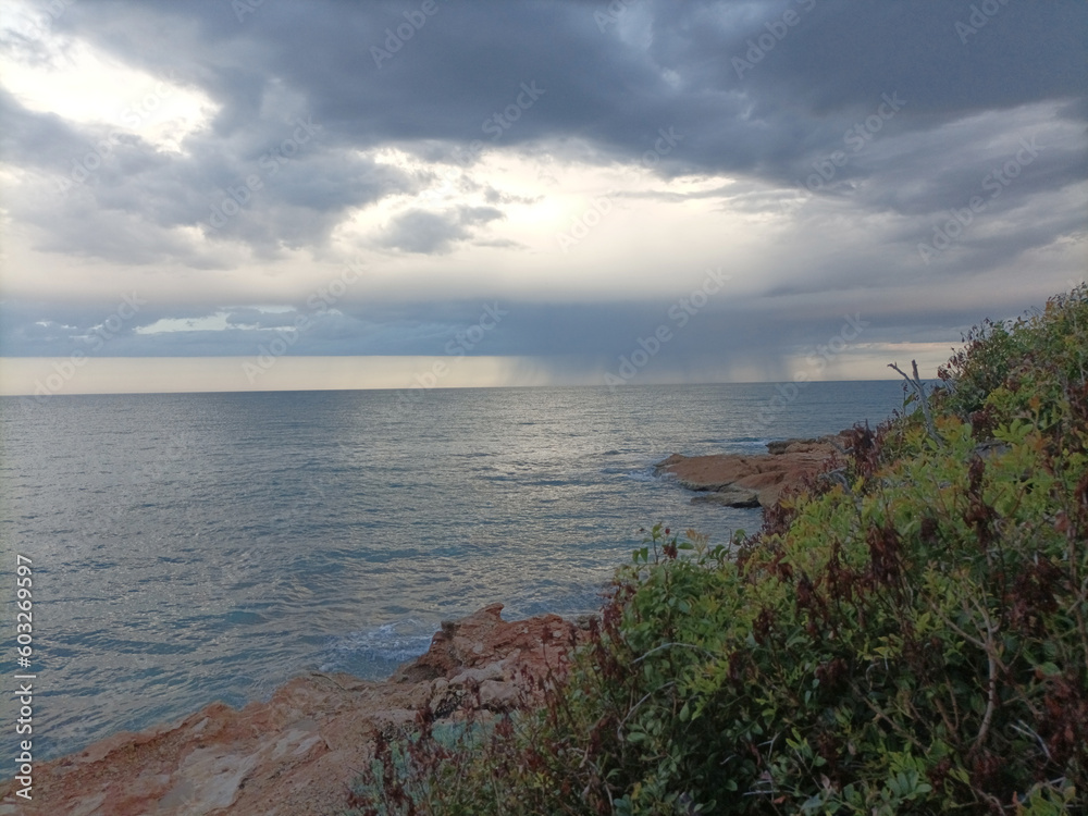 Storm Clouds Over Cold Sea Water. Stylized panoramic seascape
