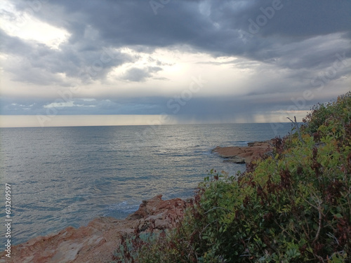 Storm Clouds Over Cold Sea Water. Stylized panoramic seascape