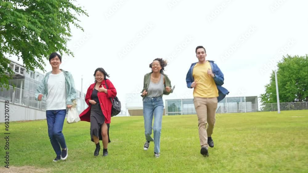 Multinational youth group running in campus of university. Multinational youth group running in campus of university.