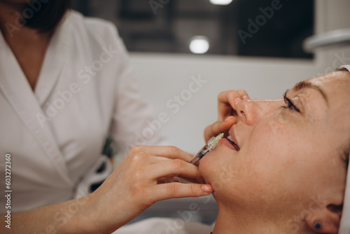 Lip Augmentation. Woman Getting Beauty Injection For Lips.