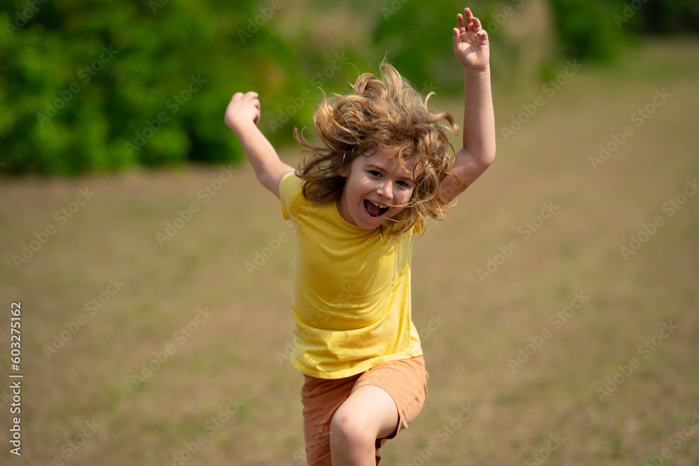 Excited Kid running in street. Amazed child enjoy run. Happy little boy running on street. Blonde cute kid run on neighborhood running road. Child boy running in park sports and run exercise for kids. Excited Kid running in street. Amazed child enjoy run. Happy little boy running on street. Blonde cute kid run on neighborhood running road. Child boy running in park sports and run exercise for kids.