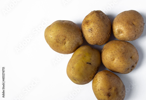 fresh potatoes just harvested on white background