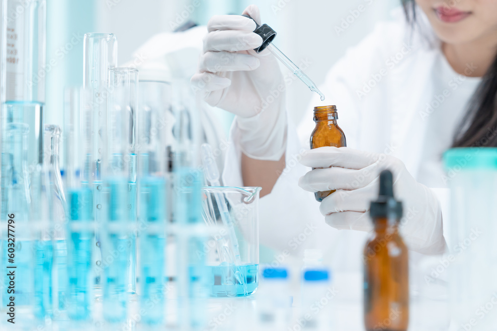 Scientist analyze biochemical samples in advanced scientific laboratory. Medical professional use dropper mix microbiological developmental of viral. Biotechnology research in science lab. cosmetic Scientist analyze biochemical samples in advanced scientific laboratory. Medical professional use dropper mix microbiological developmental of viral. Biotechnology research in science lab. cosmetic